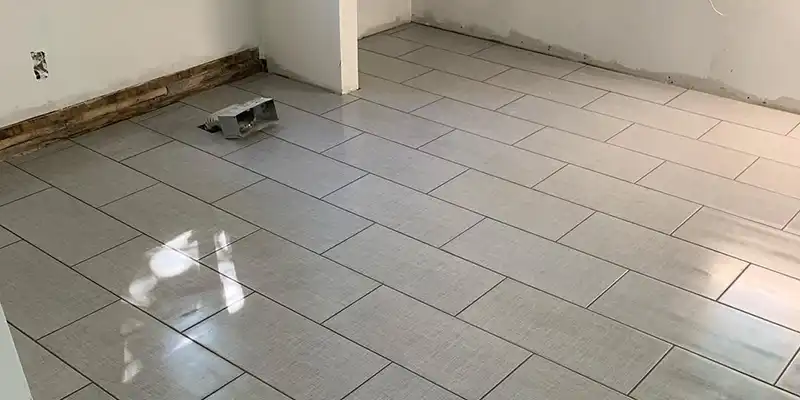 Expert tile installation by Tile Brothers Company of Buffalo, NY, in a bathroom with a creative design using various tile types and patterns.